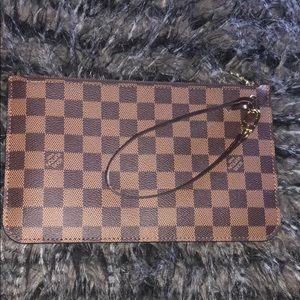 Louis pouch.   From neverfull MM